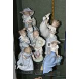 EIGHT NAO BY LLADRO FIGURES, comprising 1438 'Snowman', 1362 'Mother and Baby', 'Girl Playing With