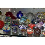A COLLECTION OF MODERN GLASS PAPERWEIGHTS, MOSTLY COLOURED, various shapes and designs including