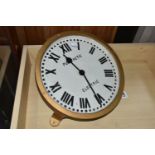 A PULSYNETIC ELECTRIC CAST IRON WALL CLOCK, repainted gilt case frame, cast painted 30cm / 12 dial