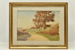 JOHN HAGGIS (1897-1968) A LANDSCAPE VIEW ALONG A PATH WITH TREES, signed bottom left, oil on