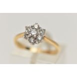 AN 18CT GOLD DIAMOND CLUSTER RING, flower cluster set with seven claw set, round brilliant cut