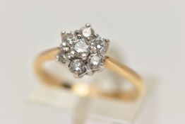 AN 18CT GOLD DIAMOND CLUSTER RING, flower cluster set with seven claw set, round brilliant cut