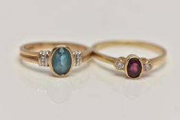 TWO 9CT GOLD GEM SET RINGS, the first set with an oval cut blue topaz, collet set to a white metal