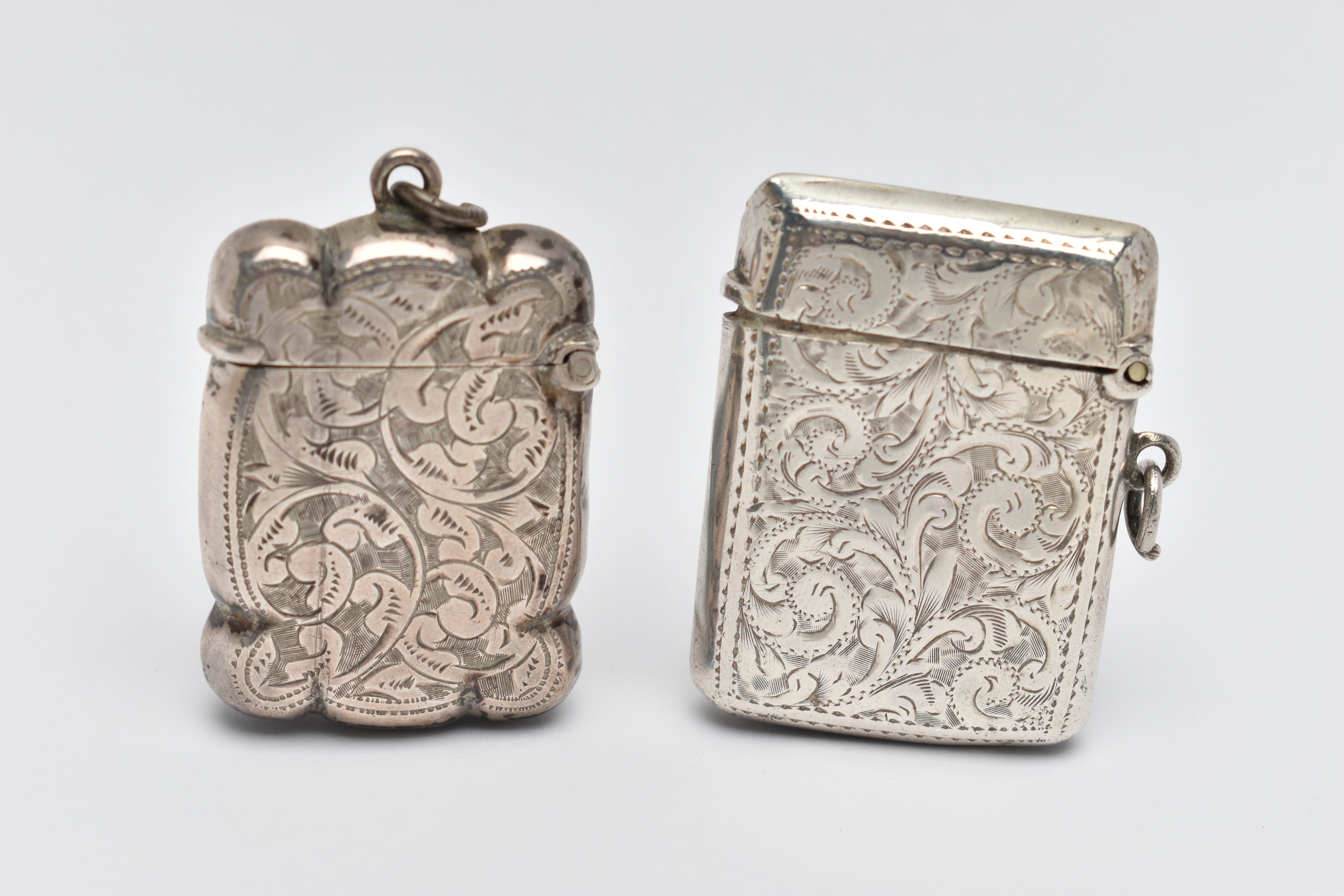 TWO SILVER VESTA CASES, the first of a rectangular form, detailed with acanthus leaves and