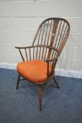 AN ERCOL WINDSOR ARMCHAIR, with a seat pad (condition report: -good)
