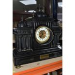 A LARGE BLACK SLATE MANTEL CLOCK c1908, of architectural form, the case having six columns,