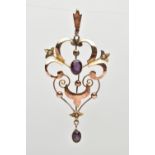 AN EARLY 20TH CENTURY LAVALIER PENDANT, an open work scrolling pendant, set with two seed pearls and
