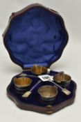 A CASED SET OF LATE VICTORIAN SILVER SALTS, case opens to reveal four salts in the form of buckets