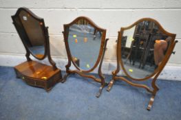 A GEORGIAN STYLE MAHOGANY SHIELD SWING MIRROR, with two drawers, and two other shield swing