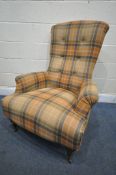A TARTAN UPHOLSTERED HIGH BACK ARMCHAIR, on tapered front legs and ceramic casters, width 82cm x