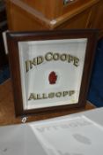 AN OAK FRAMED PUB ADVERTISING MIRROR, 'Ind Coope Allsopp', with the Red Hand design to the centre,