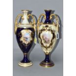 TWO EARLY 20TH CENTURY COALPORT TWIN HANDLED PEDESTAL VASES IN BLUE, PALE YELLOW AND GILT, both