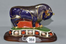 A ROYAL CROWN DERBY IMARI BULL, issued 1992-2002, gold button stopper, height 13cm, together with an