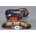 A ROYAL CROWN DERBY IMARI BULL, issued 1992-2002, gold button stopper, height 13cm, together with an