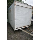A LARGE TWIN AXLE BOX VAN TRAILER, with a roller at each end, length 306cm x 202cm wide x height