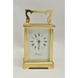 A 'H.SAMUEL' BRASS CARRIAGE CLOCK, key wound, Roman numeral dial, in working order time keeping