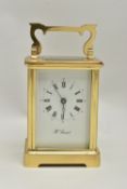 A 'H.SAMUEL' BRASS CARRIAGE CLOCK, key wound, Roman numeral dial, in working order time keeping