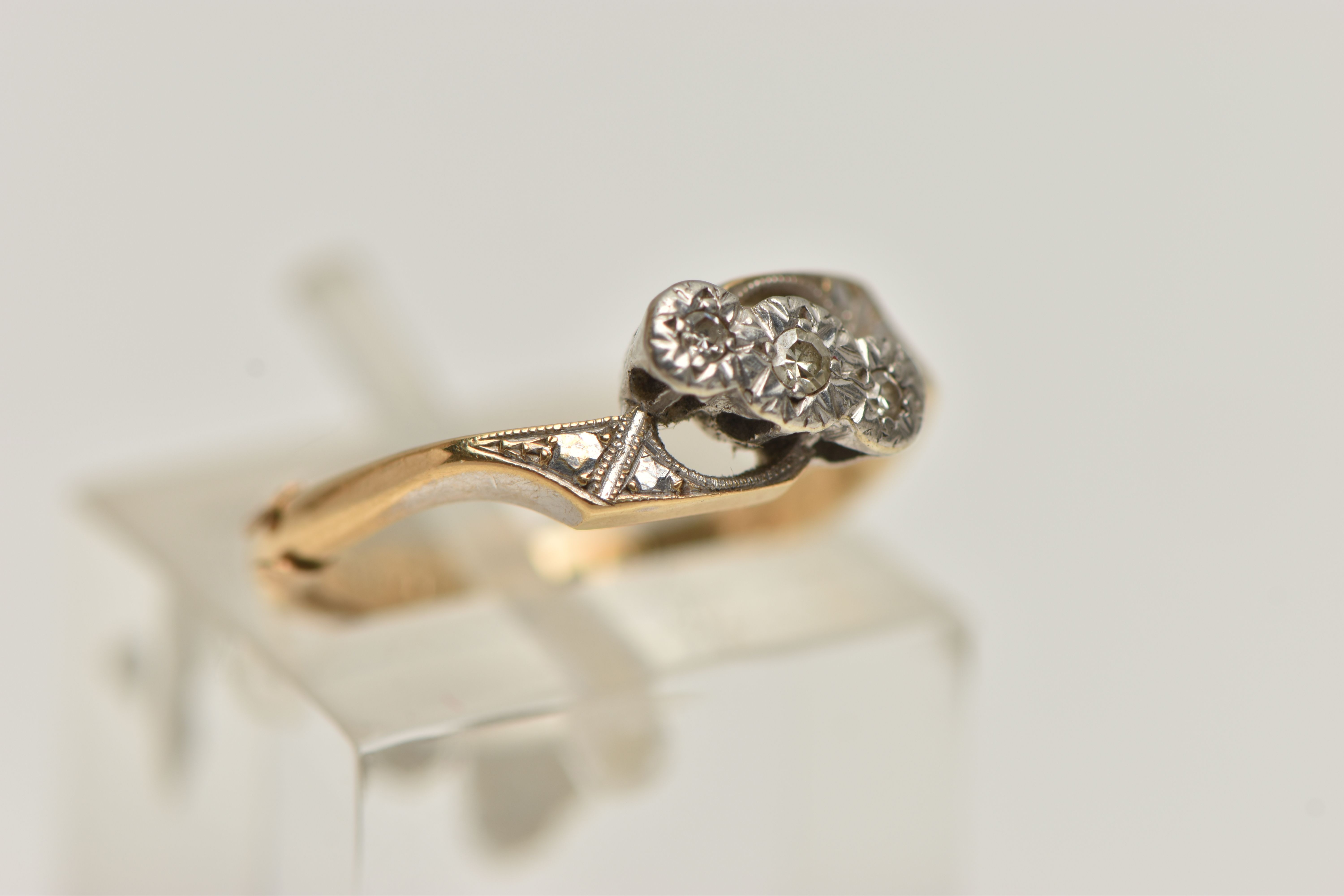 A THREE STONE DIAMOND RING, a yellow and white metal three stone diamond ring, three small single - Image 4 of 4