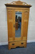 A 20TH CENTURY SATINWOOD WARDROBE, with a single mirrored door, above a single drawer, width 105cm x