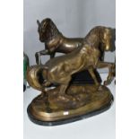 TWO REPRODUCTION BRONZED METAL SCULPTURES OF HORSES, both with a raised front leg, the one on an