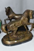 TWO REPRODUCTION BRONZED METAL SCULPTURES OF HORSES, both with a raised front leg, the one on an