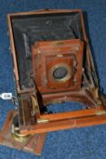 A THORNTON-PICKARD 'VICTO' MAHOGANY CASED FIELD CAMERA WITH A HYDE & CO LONDON BRASS LENS, f8-64 (3)