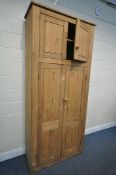 A HEAVY 19TH CENTURY PITCH PINE PANELLED FOUR DOOR HOUSEKEEPERS CUPBOARD, enclosing shelves, width