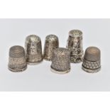 SIX THIMBLES, to include five with full silver hallmarks, approximate gross weight 19.6 grams, one
