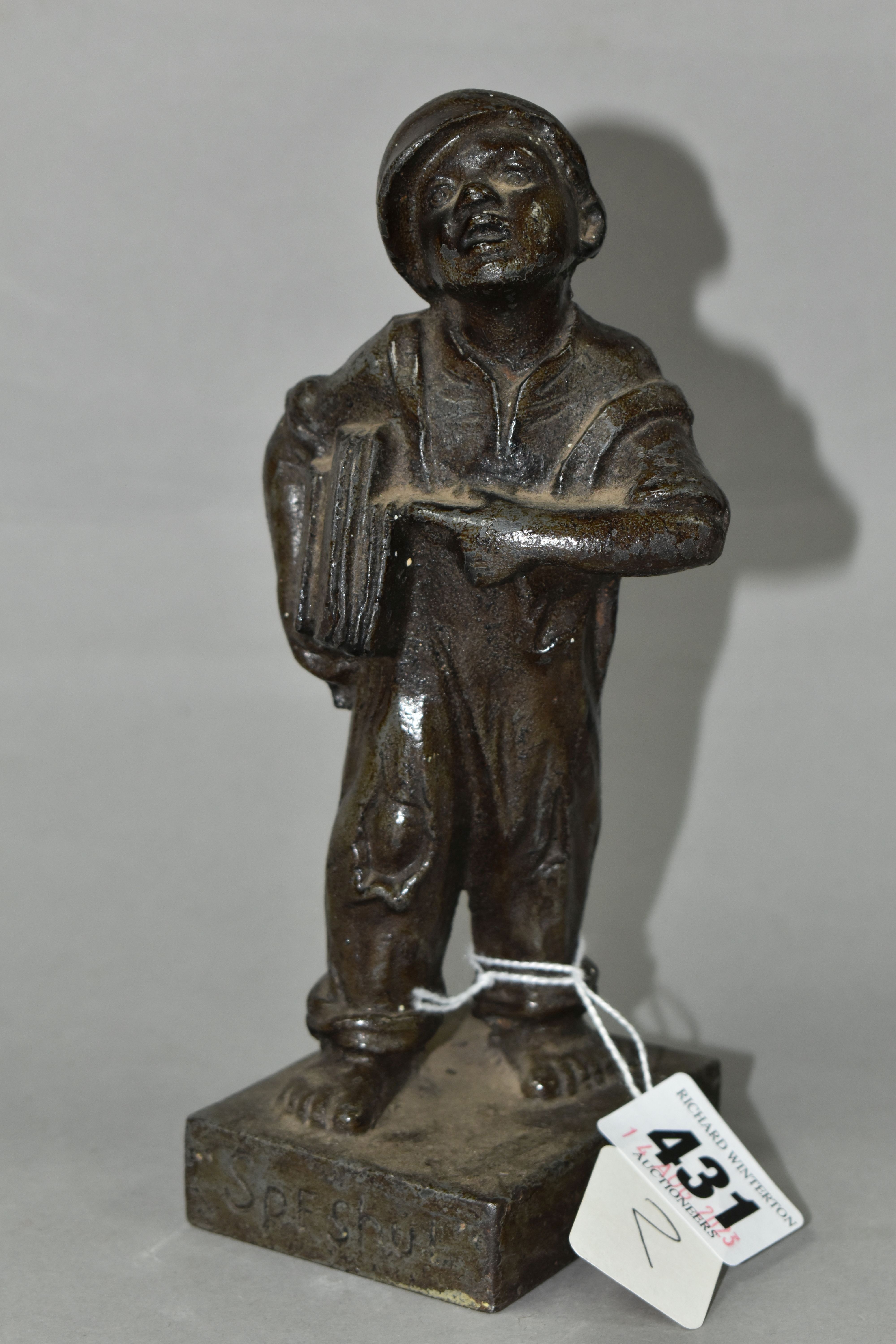A BRONZED CAST IRON QUALCAST ADVERTISING FIGURE OF A NEWS BOY, titled 'Speshul', impressed