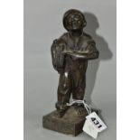 A BRONZED CAST IRON QUALCAST ADVERTISING FIGURE OF A NEWS BOY, titled 'Speshul', impressed