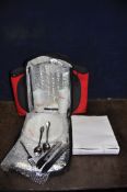 A MAKITA RUCKSACK COOL BAG PICNIC SET with four branded plastic plates, cups, knives, forks and
