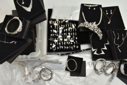 BOXED AND LOOSE SETS OF COSTUME JEWELLERY, to include a ring box with mostly white metal rings, a