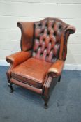A RED LEATHER CHESTERFIELD WING BACK ARMCHAIR, on cabriole legs, width 83cm x depth 85cm x height