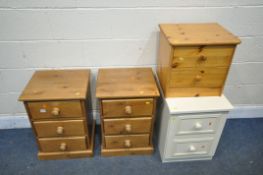 A PAIR OF MODERN PINE THREE DRAWER BEDSIDE CHESTS, a two drawer bedside chest, and a cream two