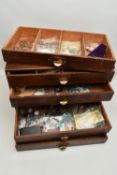 A WATCH MAKERS WOODEN CHEST/DRAWERS CONTAINING WATCH PARTS AND STRAPS, TOOLS AND MISCELLANEOUS