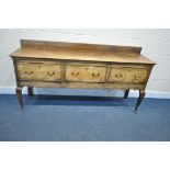 A GEORGIAN OAK DRESSER BASE, with a raised back, three drawers, wavy apron, on cabriole legs and