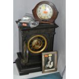 A LATE 19TH CENTURY BLACK SLATE CLOCK, engraved decoration to front, two columns, brass bezel, Roman