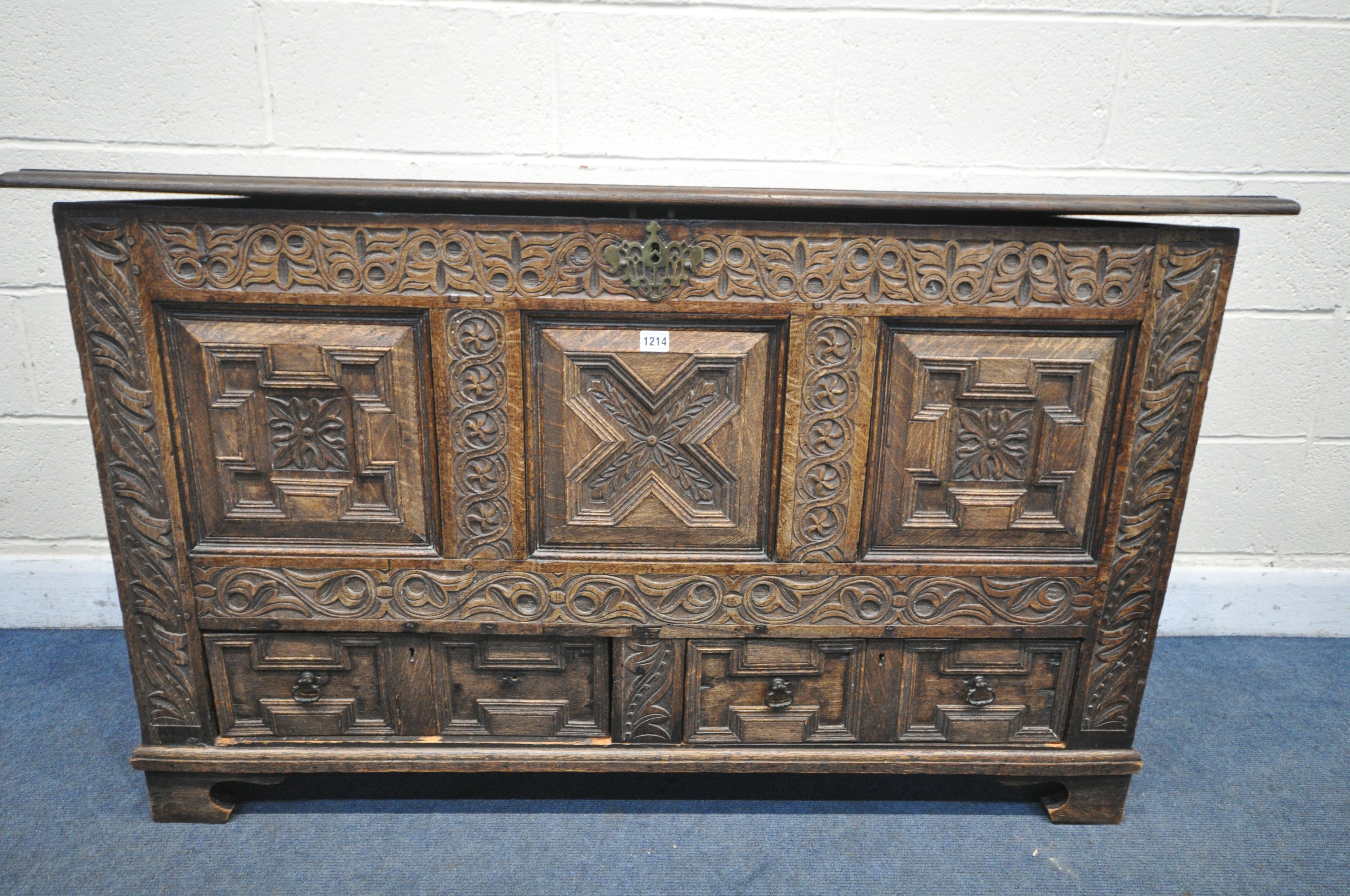 A GEORGIAN AND LATER CARVED OAK PANELLED MULE CHEST, the front with geometric panels, foliate - Image 3 of 4