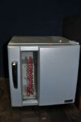 A BUDWEISER BRANDED HUSKY BOTTLE FRIDGE (PAT pass and working at 5 degrees)