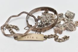 AN ASSORTMENT OF SILVER BRACELETS, two hinged bangles, an AF identification tag bracelet, and an