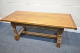 A SOLID OAK COFFEE TABLE, on turned and block legs, united by a H stretcher, length 120cm x depth