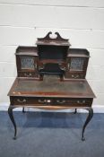 AN LATE VICTORIAN MAHOGANY LADIES DESK, the raised back with drawers and cupboards, over a base with