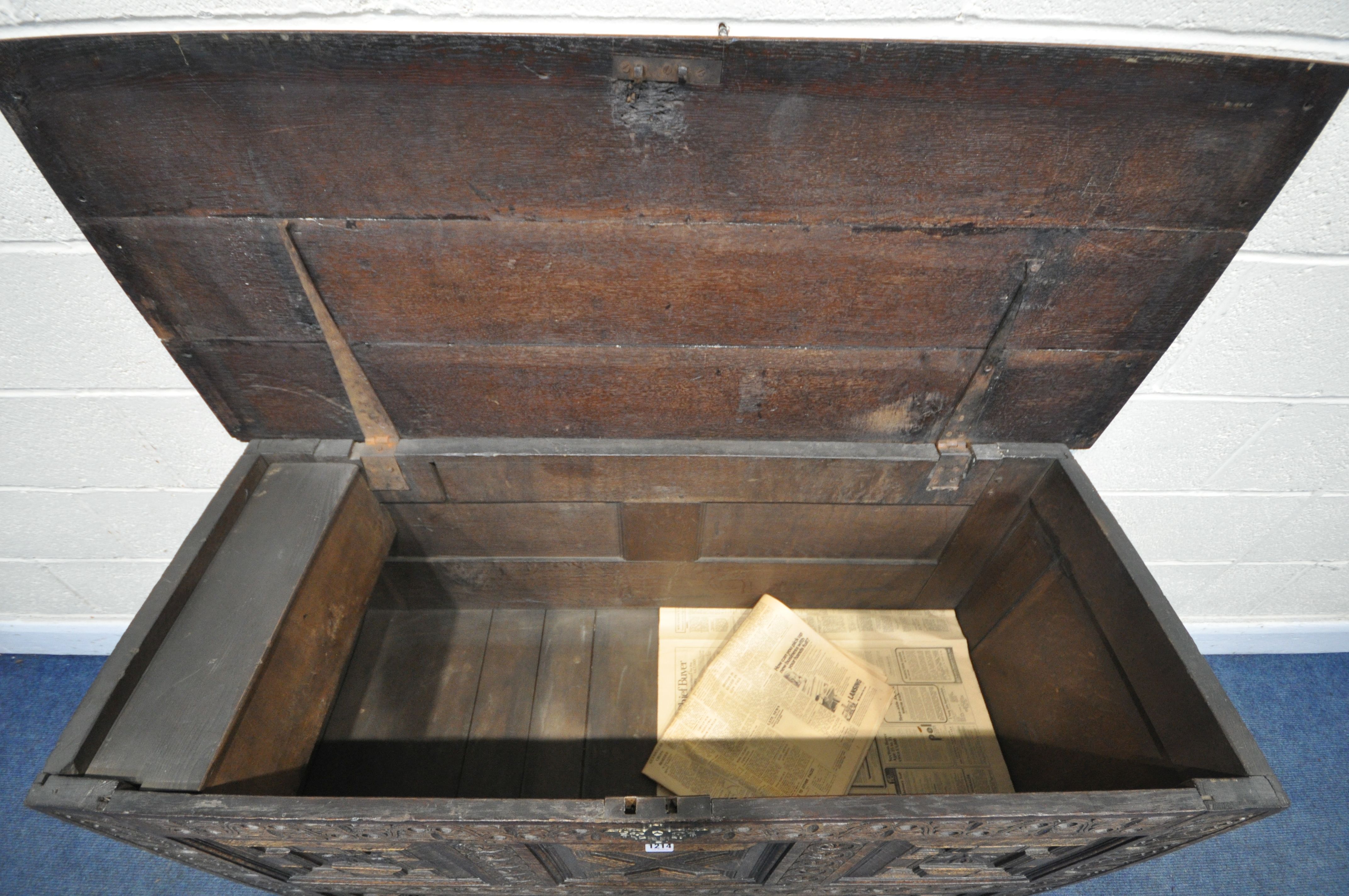 A GEORGIAN AND LATER CARVED OAK PANELLED MULE CHEST, the front with geometric panels, foliate - Image 4 of 4