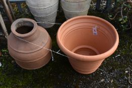 A CYLINDRICAL TAPERED TERRACOTTA POT, diameter 56cm x height 47cm, along with another terracotta pot