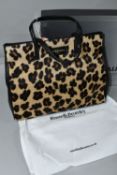 A NEW AND UNUSED RUSSELL & BROMLEY HANDBAG, faux leopard print with dust bag, original shoulder