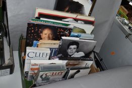ONE BOX OF CLIFF RICHARD MEMORABILIA, to include Books, CDs, DVDs, VHS Cassette Tapes, Programmes