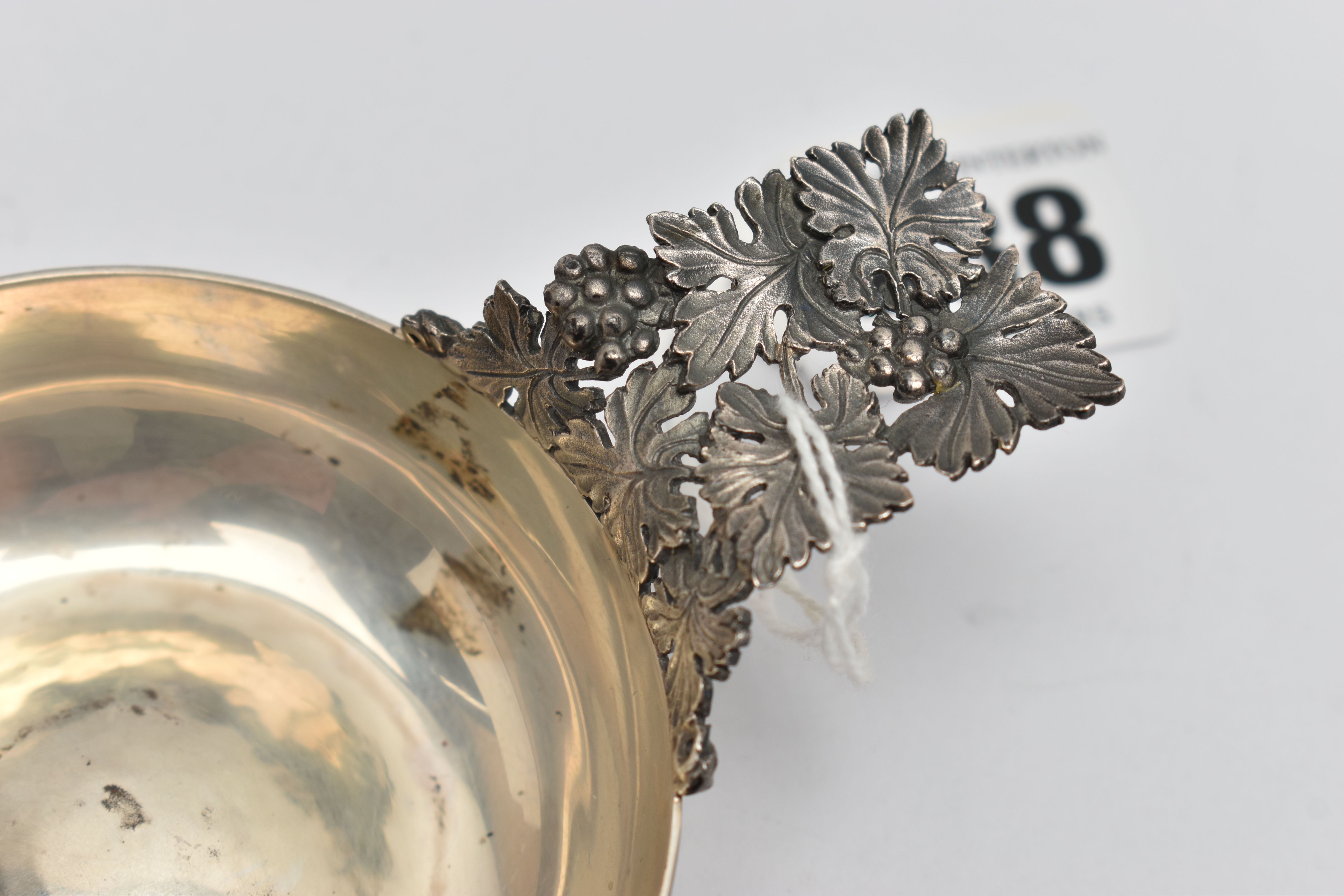 AN ELIZABETH II HECTOR MILLER SILVER WINE TASTER, planished bowl with cast and pierced fruiting vine - Image 2 of 3