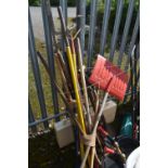 A SELECTION OF VARIOUS GARDENING TOOLS, to include shovels, rakes, brushes, etc, and a self-