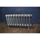 A MODERN CAST IRON RADIATOR with black chromed fittings, width 90cm x depth 13cm x height 45cm (