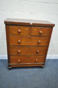 A VICTORIAN WALNUT CHEST OF TWO SHORT OVER THREE LONG DRAWERS, with turned handles, on bun feet,